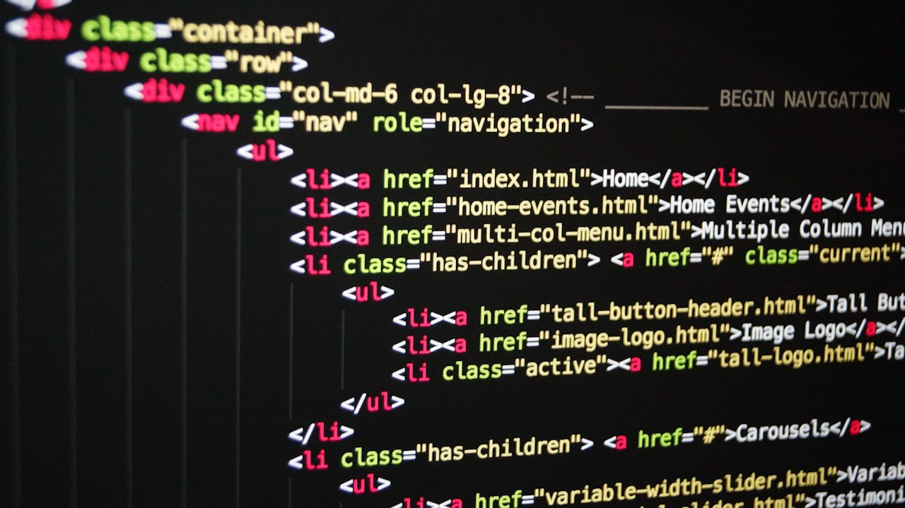 services-01 Close-up of vibrant HTML code displayed on a computer screen, showcasing web development and programming.