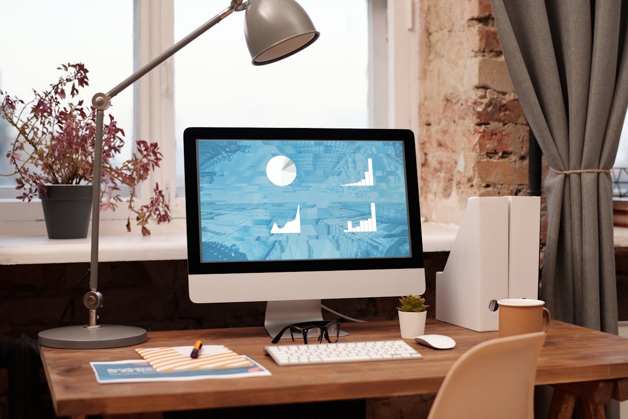 services-03 Clean and modern home office setup with computer, lamp, and decor. Ideal for productivity in a contemporary workspace.
